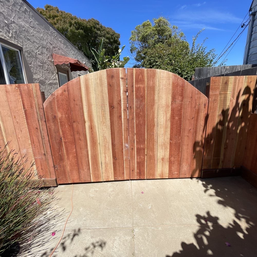 Cedar fence with an arched gate