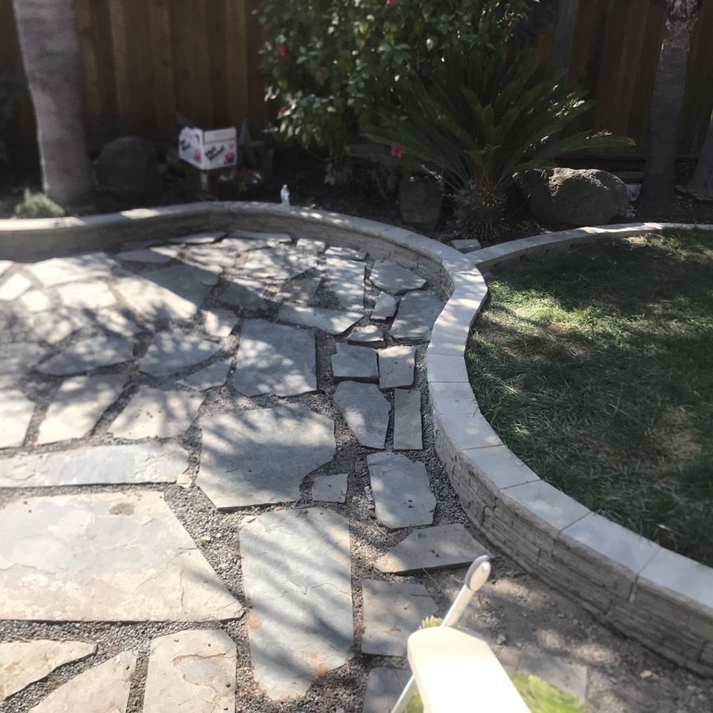 Natural stone patio with curved border